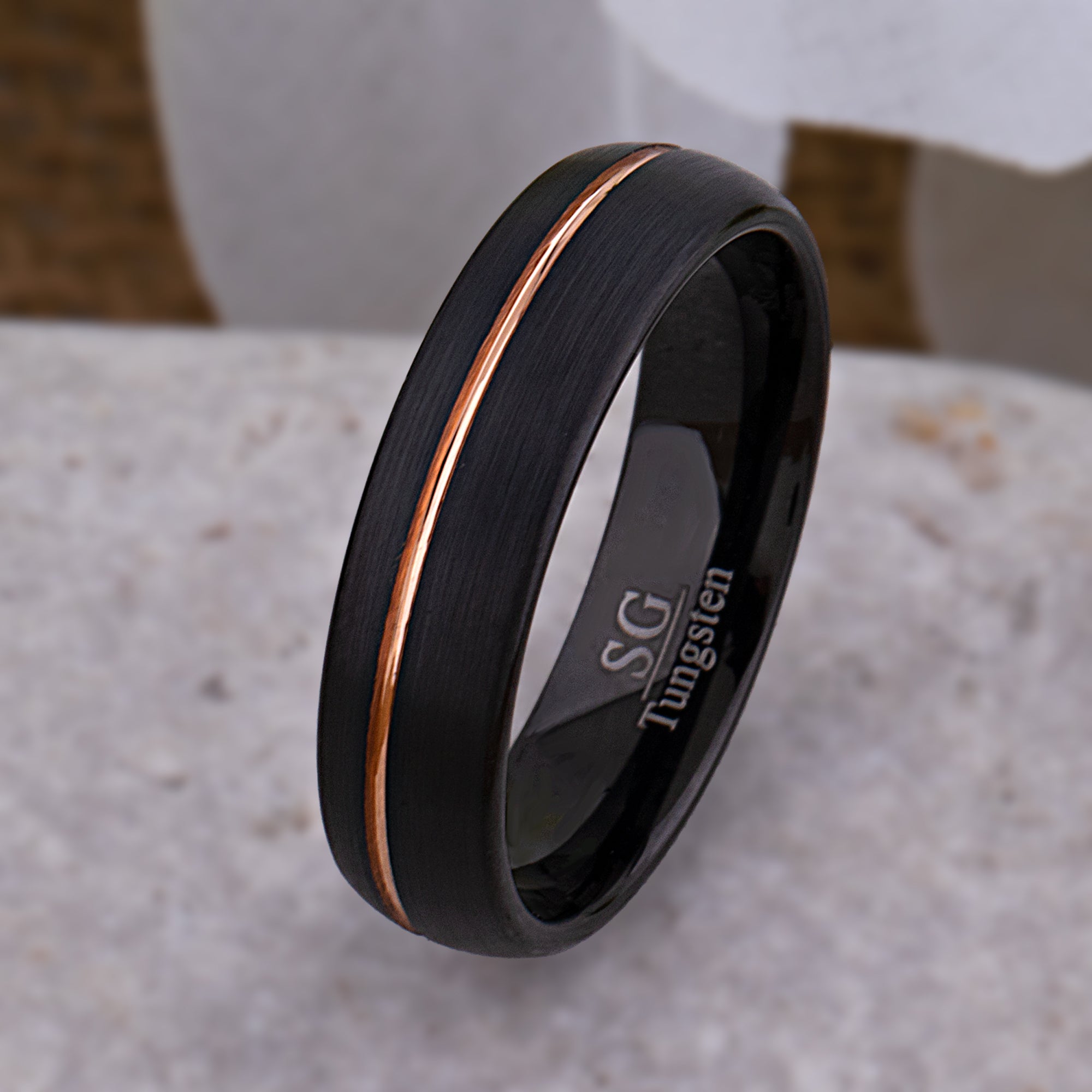 TCR203-mp-BKG-BLUR--black-tungsten-wedding-band-ring-with-rose-gold-center-line-for-men-or-women-best-promise-ring-for-friend-anniversary-ring-for-husband-or-wife_2048x.jpg?v=1667946660